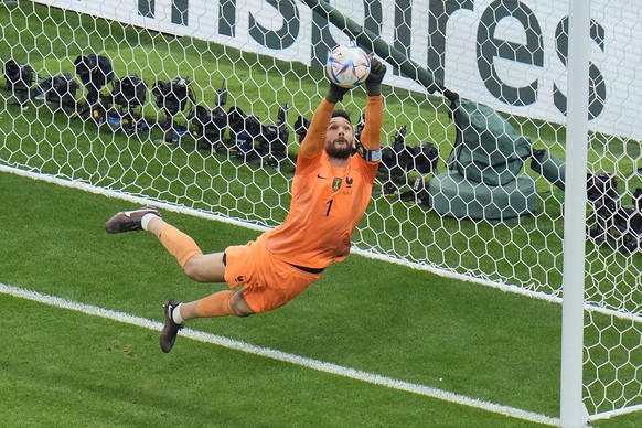 France&#039;s goalkeeper Hugo Lloris makes a save from England&#039;s Harry Kane during the World Cup quarterfinal soccer match between England and France, at the Al Bayt Stadium in Al Khor, Qatar, Sa ...