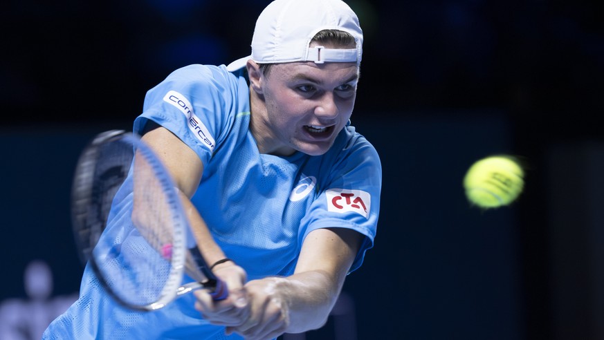 Switzerland&#039;s Dominic Stricker returns a ball to Denmark&#039;s Holger Rune during their round of sixteen match at the Swiss Indoors tennis tournament at the St. Jakobshalle in Basel, Switzerland ...