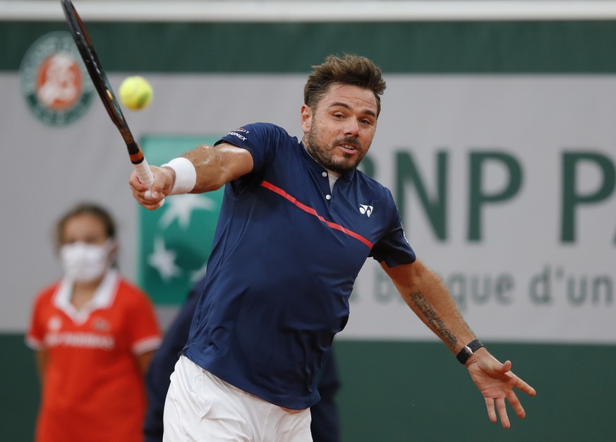 FILE - Switzerland&#039;s Stan Wawrinka plays a shot against Britain&#039;s Andy Murray in the first round match of the French Open tennis tournament at the Roland Garros stadium in Paris, France, Sun ...