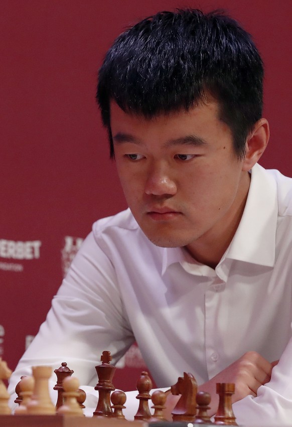 epa10615489 Chinese chess grandmaster Ding Liren, the reigning World Chess Champion, prepares for a move against Russian chess grandmaster Ian Nepomniachtchi (unseen) during their game at the third ro ...
