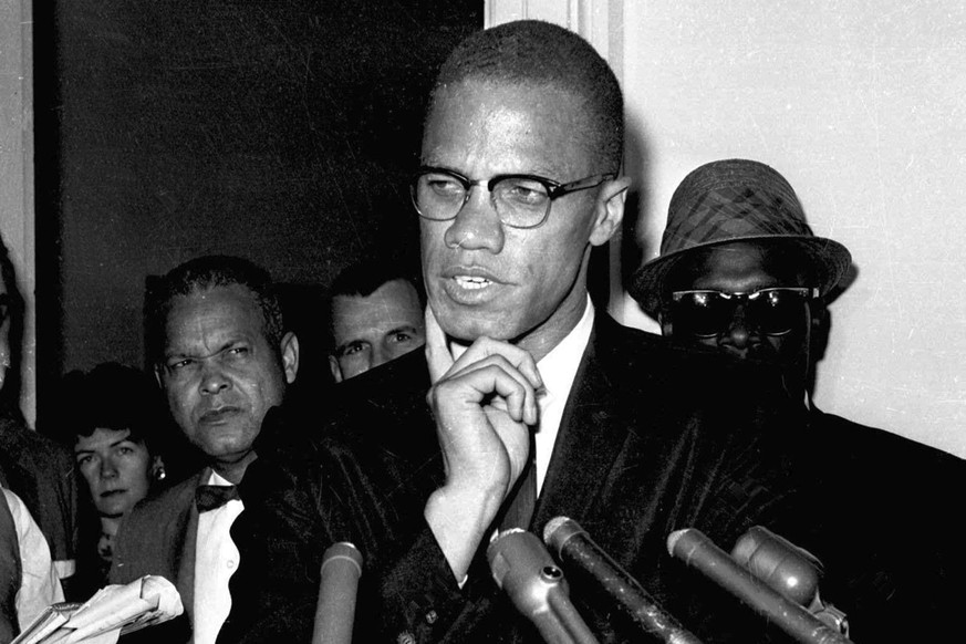 FILE - Malcolm X speaks to reporters in Washington, D.C., May 16, 1963. Two of the three men convicted in the assassination of Malcolm X are set to be cleared Thursday, Nov. 18, 2021, after insisting  ...