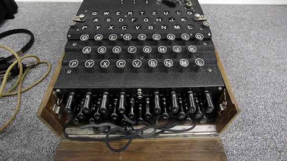 A Nazi Enigma encryption machine is displayed at the World War II Museum in Natick, Mass., Wednesday, Feb. 18, 2015. In the Oscar-nominated film &amp;quot;The Imitation Game,&amp;quot; Benedict Cumber ...