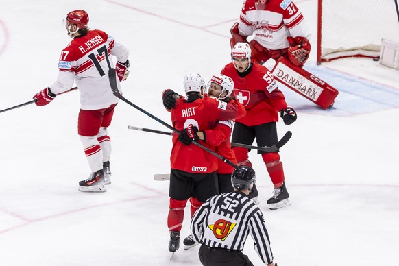 Switzerland&#039;s forward Damien Riat #9 celebrates his goal with his teammates Switzerland&#039;s forward Christoph Bertschy and Switzerland&#039;s defender Tim Berni #56, after scoring the 6:0, dur ...
