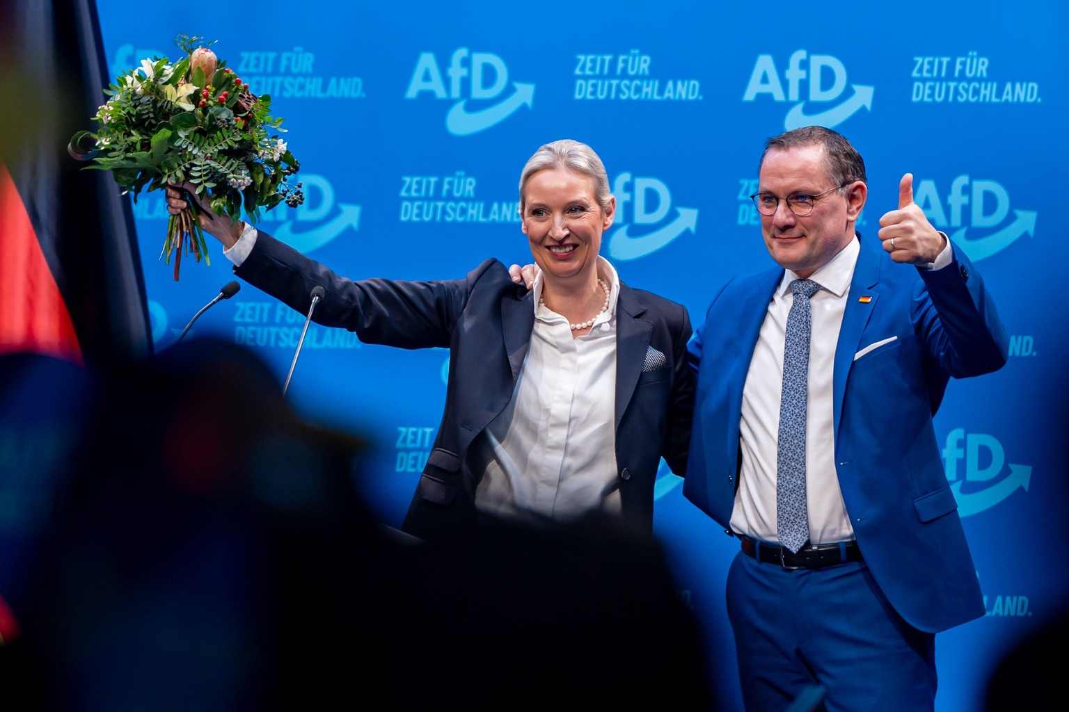 epa11818520 Alternative for Germany (AfD) party and faction co-chairman Tino Chrupalla (R) stands with AfD party and faction co-chairwoman and top candidate for the federal election Alice Weidel (L) a ...