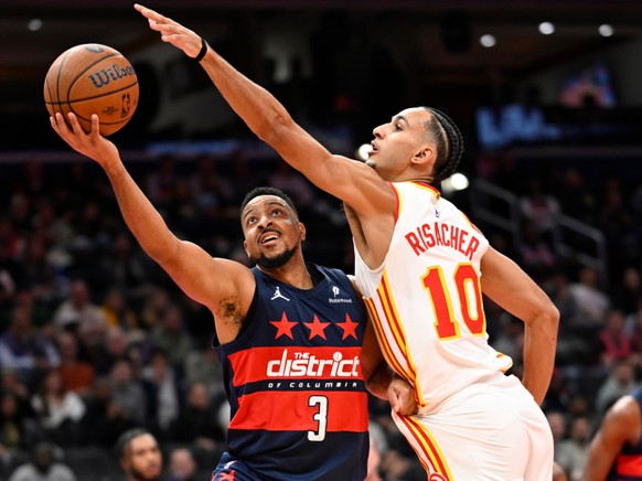 CJ McCollum (à gauche) a été le grand artisan de la victoire des Wizards contre les Hawks de Zaccharie Risacher.
