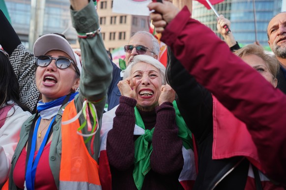 Iranian people attend a demonstration in support U.S. and Israeli strikes on Iran, in Berlin, Germany, Saturday, Feb. 28, 2026. (AP Photo/Markus Schreiber)
Germany Iran US Israel