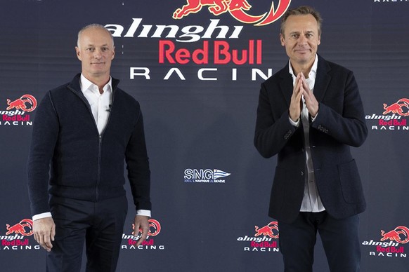 Ernesto Bertarelli, right, CEO of Alinghi Red Bull Racing and Founder Team Alinghi, gestures past Hans-Peter Steinacher, left, member of board Alinghi Red Bull Racing, after announcing the participati ...