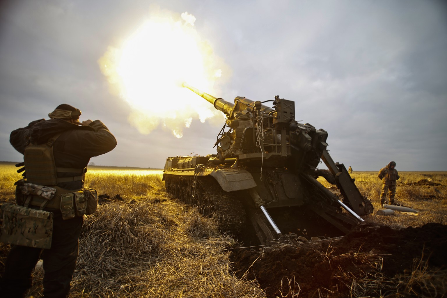 A self-propelled artillery vehicle fires near Bakhmut, Donetsk region, Ukraine, Thursday, Nov. 10, 2022. (AP Photo/Roman Chop)