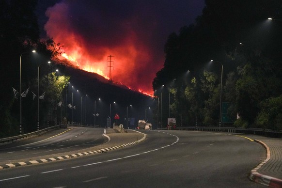 240604 -- KIRYAT SHMONA, June 4, 2024 -- Smoke and fire are seen after Lebanese rocket attacks in forests near Kiryat Shmona, Israel on June 3, 2024. Two members of the Lebanese armed group Hezbollah  ...