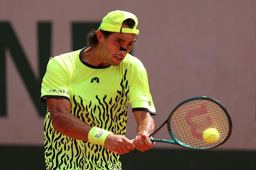 PARIS, FRANCE - MAY 25: Thiago Agustin Tirante of Argentina plays a backhand against Damir Dzumhur of Bosnia and Herzegovina in the Men&#039;s Singles First Round match on Day One of the 2025 French O ...