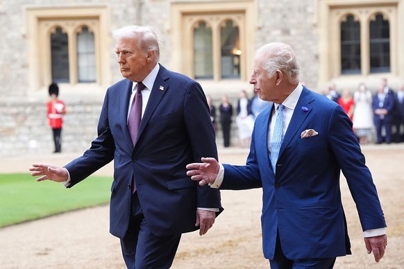 WINDSOR, ENGLAND - SEPTEMBER 17: US President Donald Trump and King Charles III during the ceremonial welcome during the State visit by the President of the United States of America on September 17, 2 ...