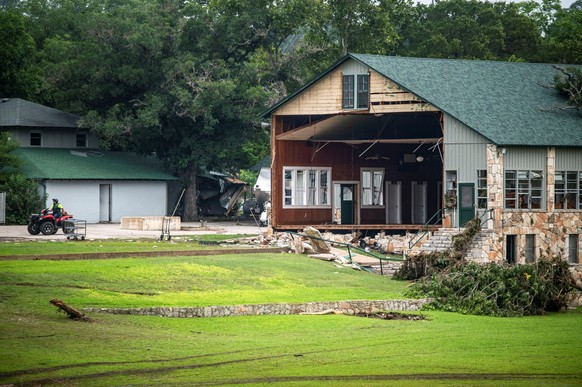 A building with a missing wall is seen at Camp Mystic after deadly flooding in Kerr County, Texas, U.S., July 5, 2025. REUTERS/Sergio Flores