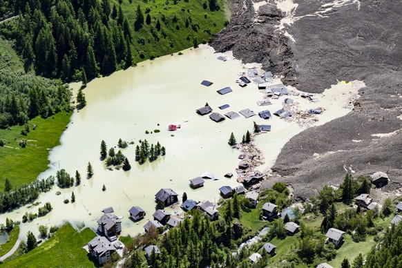 A aerial view captured one day after a massive avalanche, triggered by the collapse of the Birch Glacier, shows the destruction it caused as it swept down to the valley floor and demolishing the villa ...