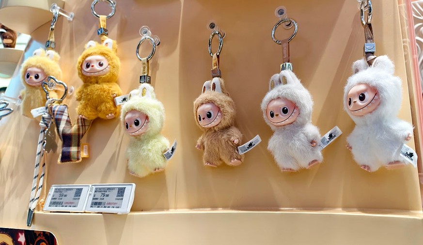 SHANGHAI, CHINA - AUGUST 28, 2025 - Customers buy mini version Labubu doll in a Pop Mart store in Shanghai, China on August 28, 2025. (Photo credit should read CFOTO/Future Publishing via Getty Images ...