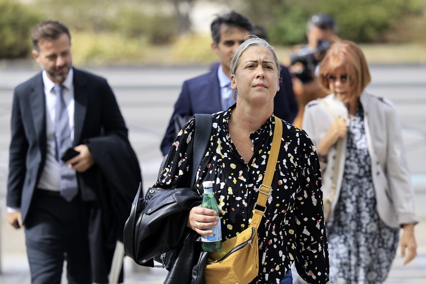 epa11609624 Gisele Pelicot (R), her daughter Caroline Darian (2-R) and her lawyers walk towards the criminal court during the trial of Gisele Pelicot&#039;s ex-husband in Avignon, southern France, 17  ...