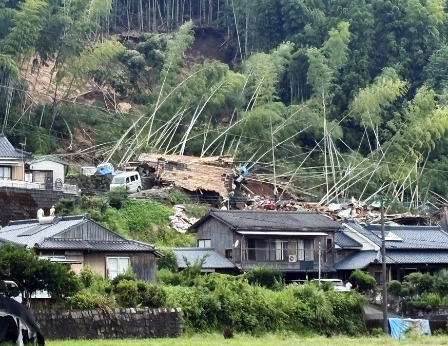 epa12293090 A house is seen destroyed by a landslide in Aira, Kagoshima Prefecture, southwestern Japan, 10 August 2025 (issued 11 August 2025). Kyushu island was hit by continuous heavy rainfall due t ...