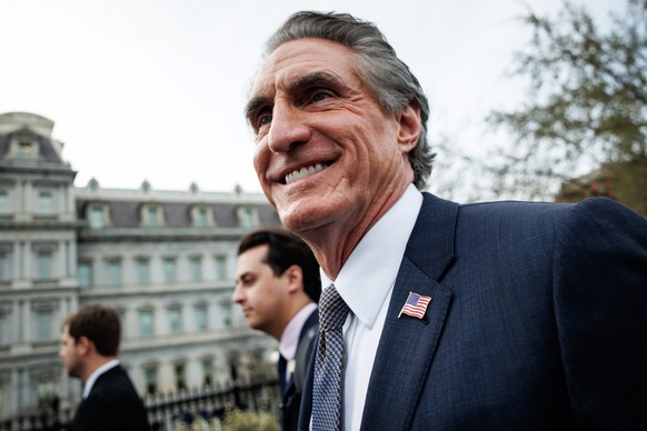 epa11974884 US Interior Secretary Doug Burgum (R) heads back into the West Wing after speaking to reporters with Energy Secretary Chris Wright (not pictured) at the White House in Washington, DC, USA, ...