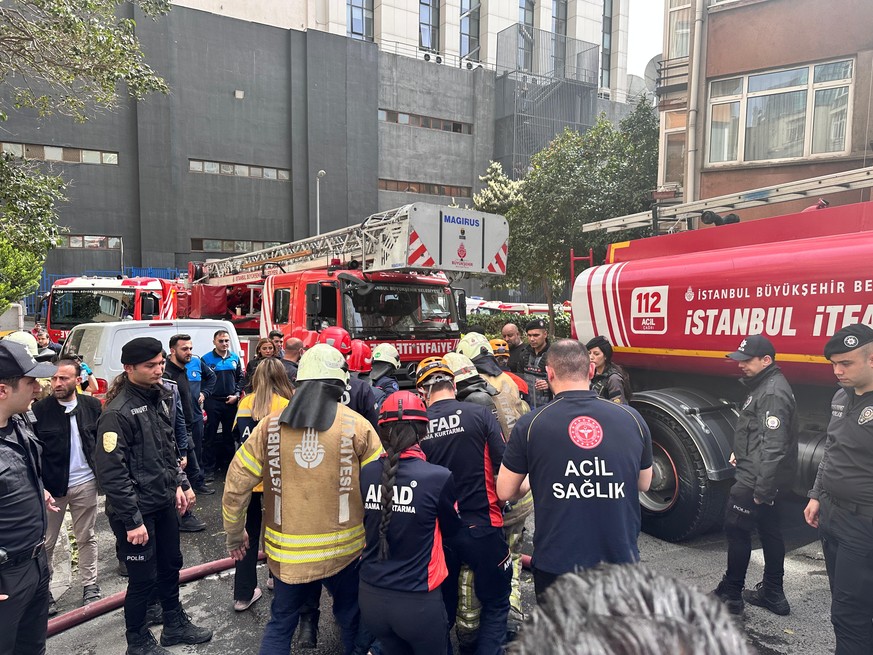 epa11255420 A handout picture provided by the Istanbul Fire Department shows, members of the Istanbul Fire Department try to control the fire at a nightclub in Istanbul, Turkey, 02 April 2024. Istanbu ...