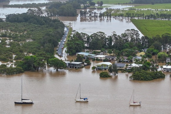 epa12124560 An aerial photo shows flooding at Settlement Point Road in Port Macquarie, New South Wales, Australia, 22 May 2025. A slow-moving trough is dumping rain along the east coast of Australia,  ...