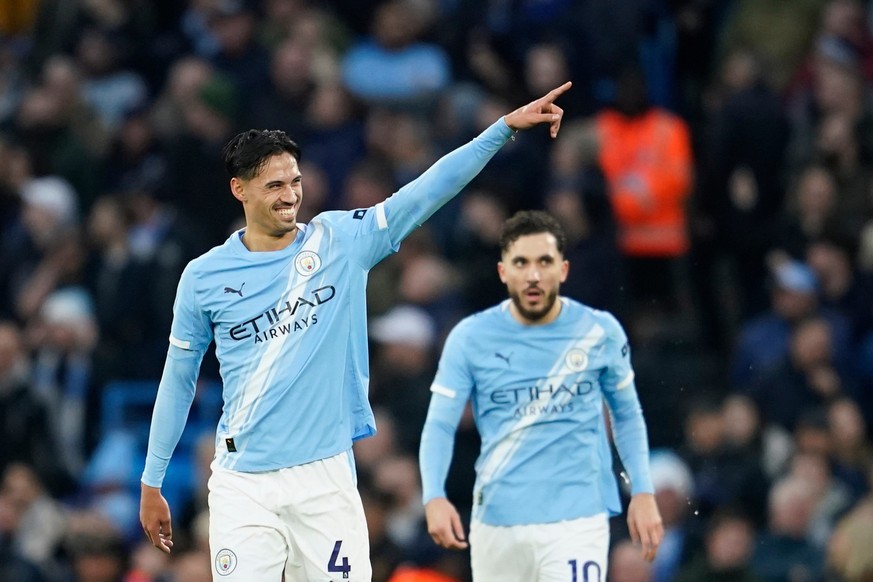 Manchester City's Tijjani Reijnders gestures to the crowd as he celebrates after scoring his side second gaol of the game during the English Premier League soccer match between Manchester City an ...