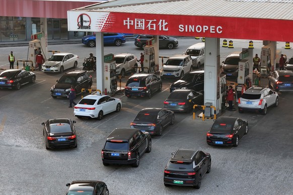 Cars line up at a gas station in Yantai in eastern China's Shandong province, Monday, March 23, 2026. (Chinatopix Via AP)
China Iran US Oil Prices