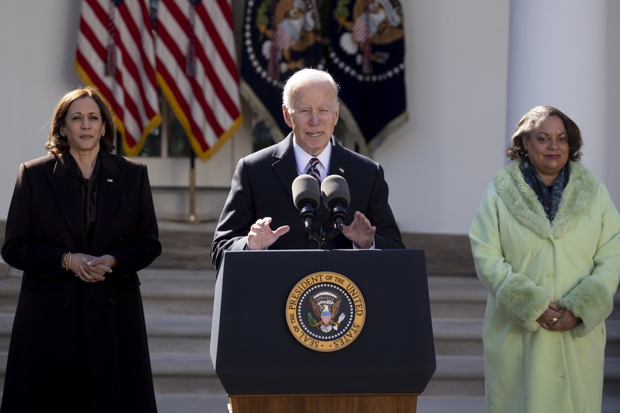epa09859441 US President Joe Biden (C) speaks beside US Vice President Kamala Harris (L) and great-granddaughter of Ida B. Wells, Michelle Duster (R); after signing into law the Emmett Till Antilynchi ...
