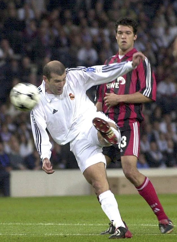 FILE - In this Wednesday, May 15, 2002 file photo Real Madrid&#039;s Zinedine Zidane scores the winning goal watched by Bayer Leverkusen&#039;s Michael Ballack during the UEFA Champions League final s ...