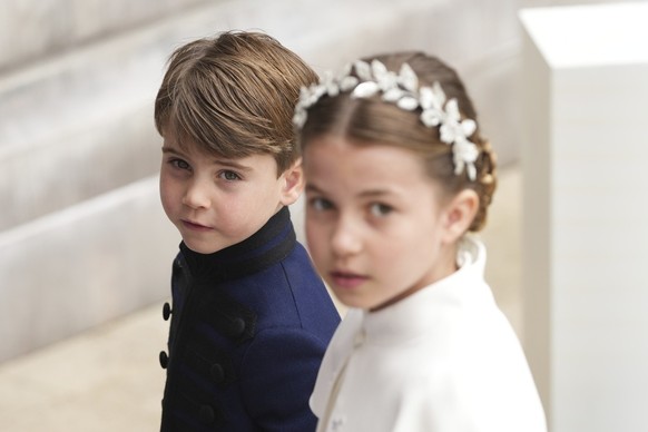 Prince Louis and Princess Charlotte, arrive for the Coronation of King Charles III, in London, Saturday, May 6 2023. King Charles III and Camila the Queen Consort, members of the Royal family and VIP& ...
