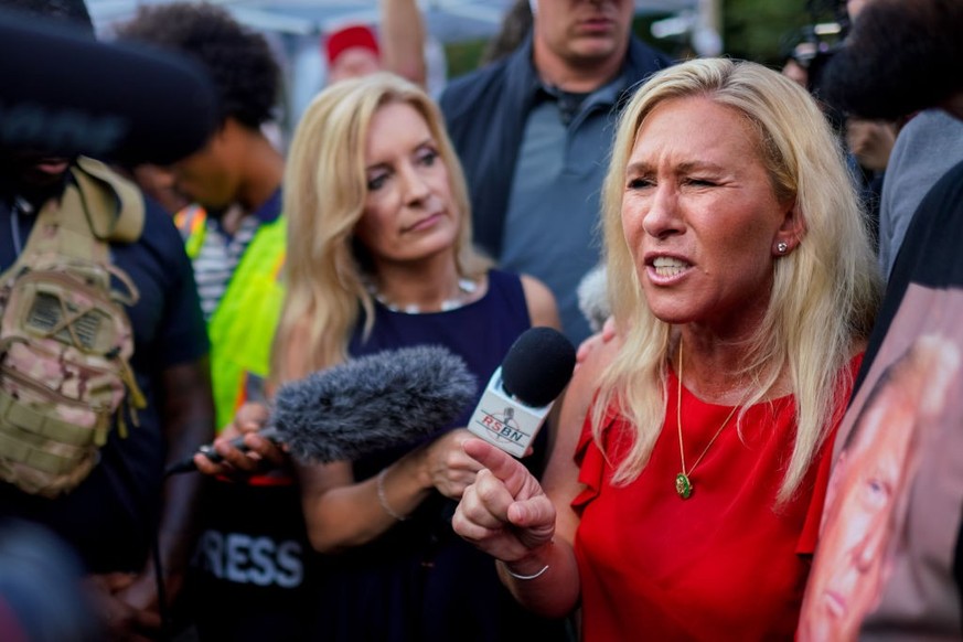 ATLANTA, GEORGIA, UNITED STATES - AUGUST 24: Marjorie Taylor Greene speaks as the arrival of former President Donald Trump outside the Fulton County Jail in Atlanta, Georgia, United States on August 2 ...