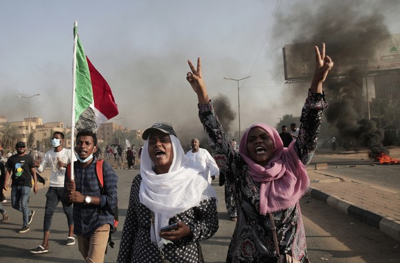Sudanese protesters take part in a rally against military rule on the anniversary of previous popular uprisings, in Khartoum, Sudan, Wednesday, April 6, 2022 . (AP Photo/Marwan Ali)