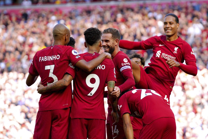 Liverpool&#039;s Roberto Firmino celebrates with his team-mates after scoring their side&#039;s seventh goal of the game during the English Premier League match between Liverpool and Bournemouth at An ...