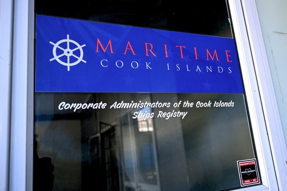 This photo taken on June 15, 2025 shows signage on a door of Maritime Cook Islands in the Cook Islands capital of Avarua. Dozens of oil tankers involved in smuggling contraband crude for Russia and Ir ...