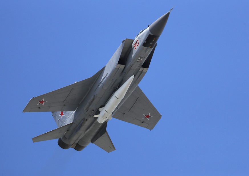 FILE - a Russian Air Force MiG-31K jet carries a high-precision hypersonic aero-ballistic missile Kh-47M2 Kinzhal during the Victory Day military parade to celebrate 73 years since the end of WWII and ...