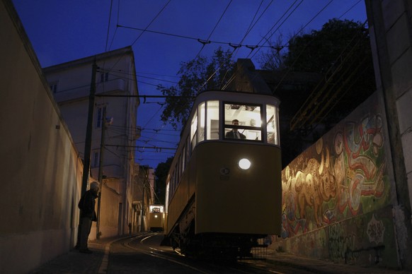 FILE - A man looks at Lisbon&#039;s Gloria funiculars as they do their last trip of the day on April 22, 2014. (AP Photo/Francisco Seco, File)
Portugal Streetcar Derailed