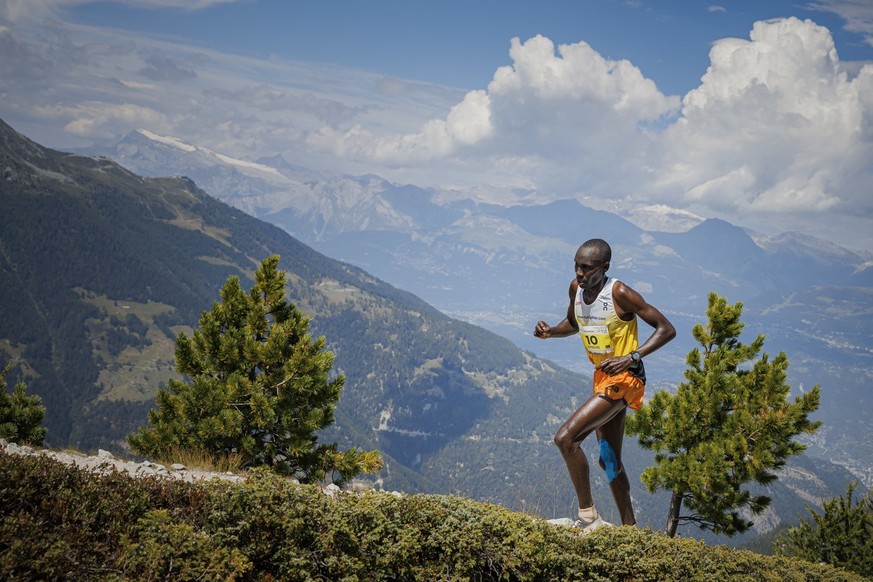 Overall second placed Patrick Kipngeno from Kenya runs towards the finish line during the 50th Sierre-Zinal long distance mountain race above the alpine village of Saint-Luc, Switzerland, Saturday Aug ...