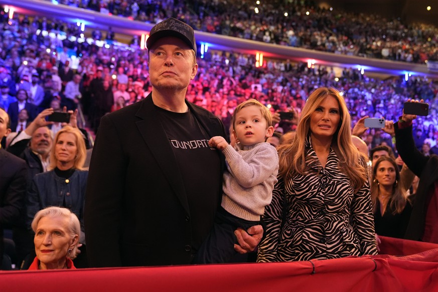 Elon Musk and former first lady Melania Trump listen as Republican presidential nominee former President Donald Trump speaks at a campaign rally at Madison Square Garden, Sunday, Oct. 27, 2024, in New ...