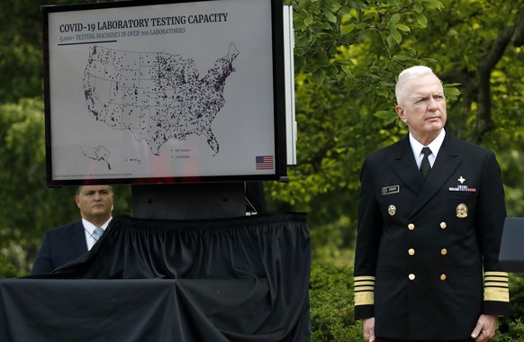 Adm. Brett Giroir, assistant secretary of Health and Human Services, listens as Brad Smith, director of the Center for Medicare &amp; Medicaid Innovation at CMS, speaks about the coronavirus during a  ...