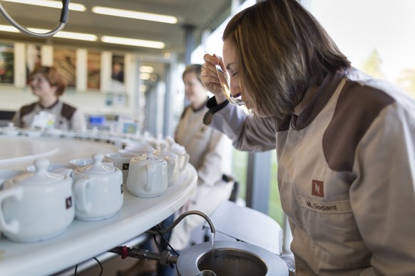 Employees test the quality of a new Nespresso coffee at the Nestle production site in Orbe in the Canton of Vaud, Switzerland, on November 18, 2015. The Swiss food and beverage company Nestle was foun ...