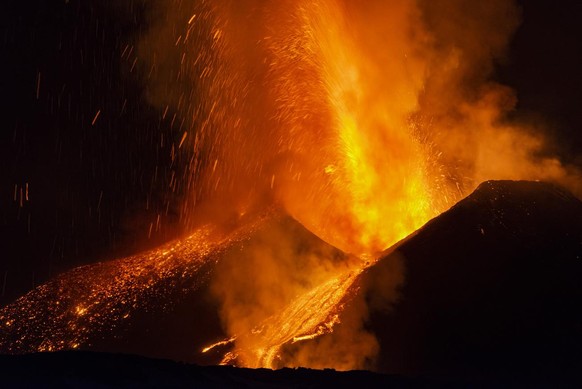 Lava flows from the Mt. Etna volcano, as seen from Nicolosi, Sicily, southern Italy, Thursday, Feb. 10, 2022. (AP Photo/Salvatore Allegra)