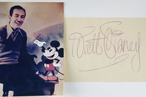 epa10366428 A cut sheet signed by Walt Disney is displayed during an auction preview titled &#039;Icons &amp; Idols; Hollywood&#039; at Julien&#039;s Auctions Beverly Hills, in Beverly Hills, Californ ...