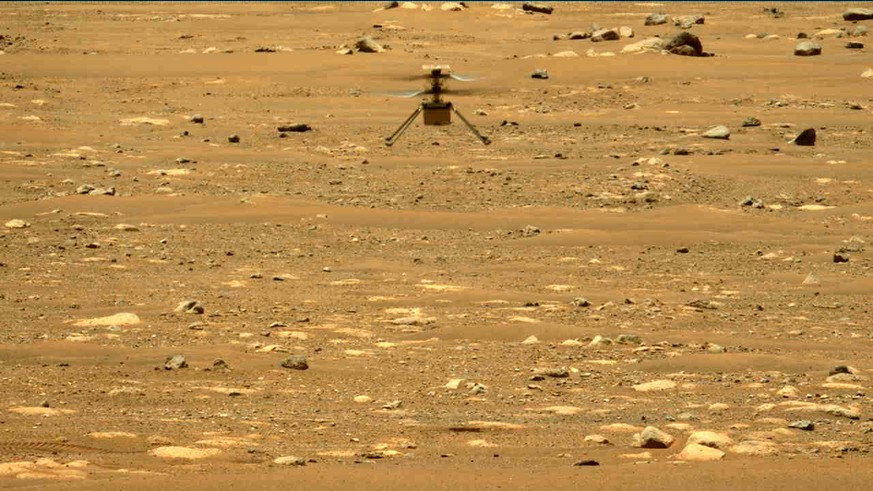 In this image made available by NASA, the Mars Ingenuity helicopter hovers above the surface of the planet during its second flight on Thursday, April 22, 2021. (NASA/JPL-Caltech/ASU/MSSS via AP)