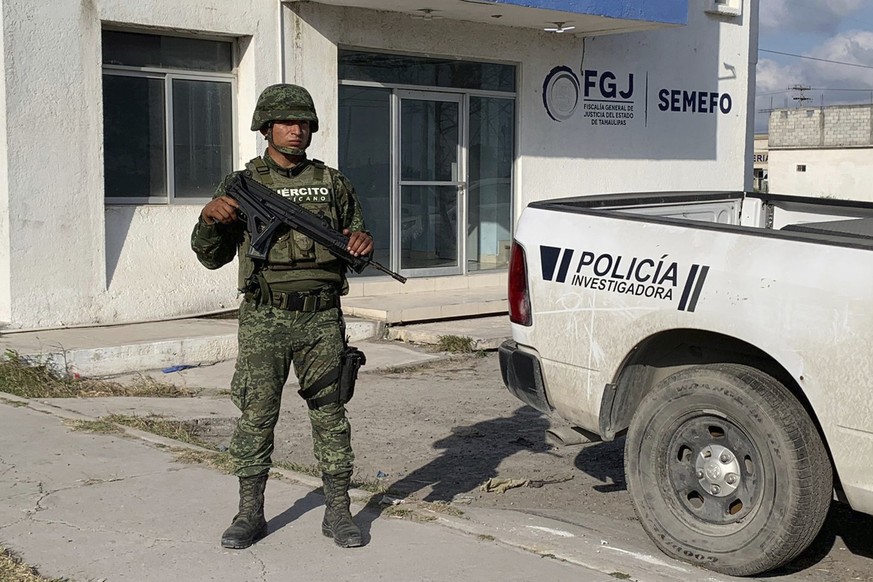 A Mexican army soldier guards the Tamaulipas State Prosecutor&#039;s headquarters in Matamoros, Mexico, Wednesday, March 8, 2023. A road trip to Mexico for cosmetic surgery veered violently off course ...
