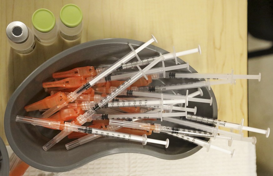 FILE - Pre-loaded syringes with COVID-19 vaccine are ready as medical staff vaccinate students at KIPP Believe Charter School in New Orleans, Jan. 25, 2022. More than $10 billion in coronavirus relief ...