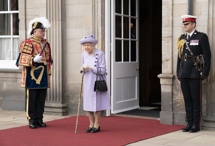 Queen Elizabeth II attends an armed forces act of loyalty parade in the gardens of the Palace of Holyroodhouse, Edinburgh, Tuesday, June 28, 2022