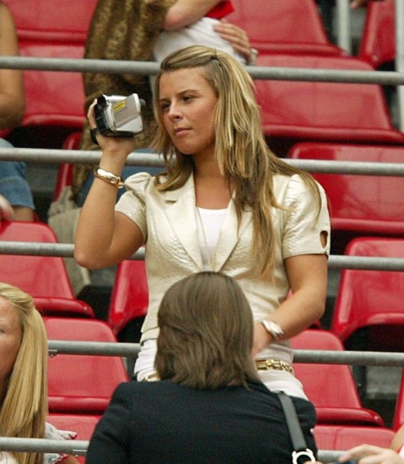 Wayne Rooney's fiancee Coleen McLoughlin uses her video camera before the match (Photo by Mike Egerton - PA Images via Getty Images)