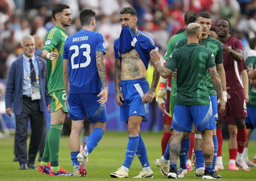 Italy's Gianluca Scamacca, centre, reacts at the end of a round of sixteen match between Switzerland and Italy at the Euro 2024 soccer tournament in Berlin, Germany, Saturday, June 29, 2024. Swit ...