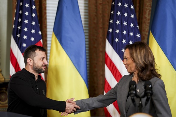 epa11627252 US Vice President Kamala Harris (R), and Ukrainian President Volodymyr Zelensky (L), shake hands at their joint press conference during a meeting in the Vice President&#039;s Ceremonial Of ...
