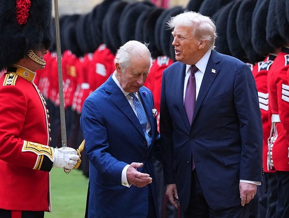 WINDSOR, ENGLAND - SEPTEMBER 17: US President Donald Trump (R) and King Charles III (C) review the Guard of Honour after their arrival at Windsor Castle on day two of the US President Donald Trump&#03 ...