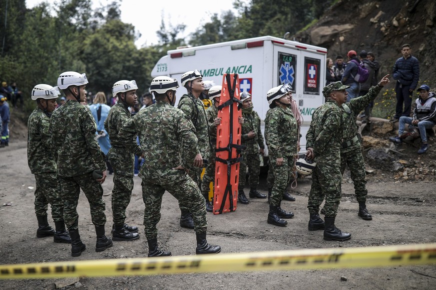 Army rescuers deploy at a coal mine after a deadly explosion in Cucunuba, Colombia, Thursday, April 20, 2023. (AP Photo/Ivan Valencia)