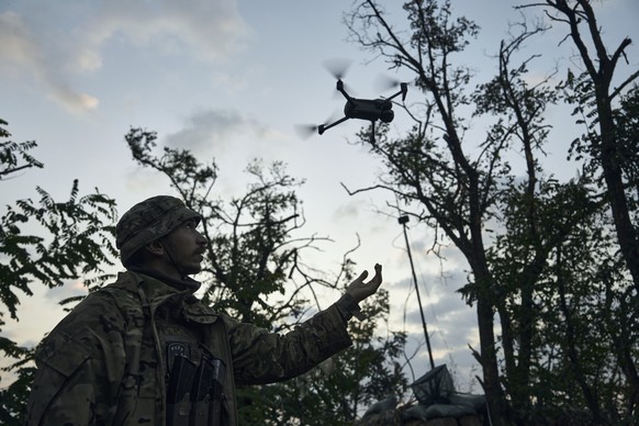 A soldier of Ukraine&#039;s 3rd Separate Assault Brigade launches a drone near Bakhmut, the site of fierce battles with the Russian forces in the Donetsk region, Ukraine, Sunday, Sept. 3, 2023. (AP Ph ...